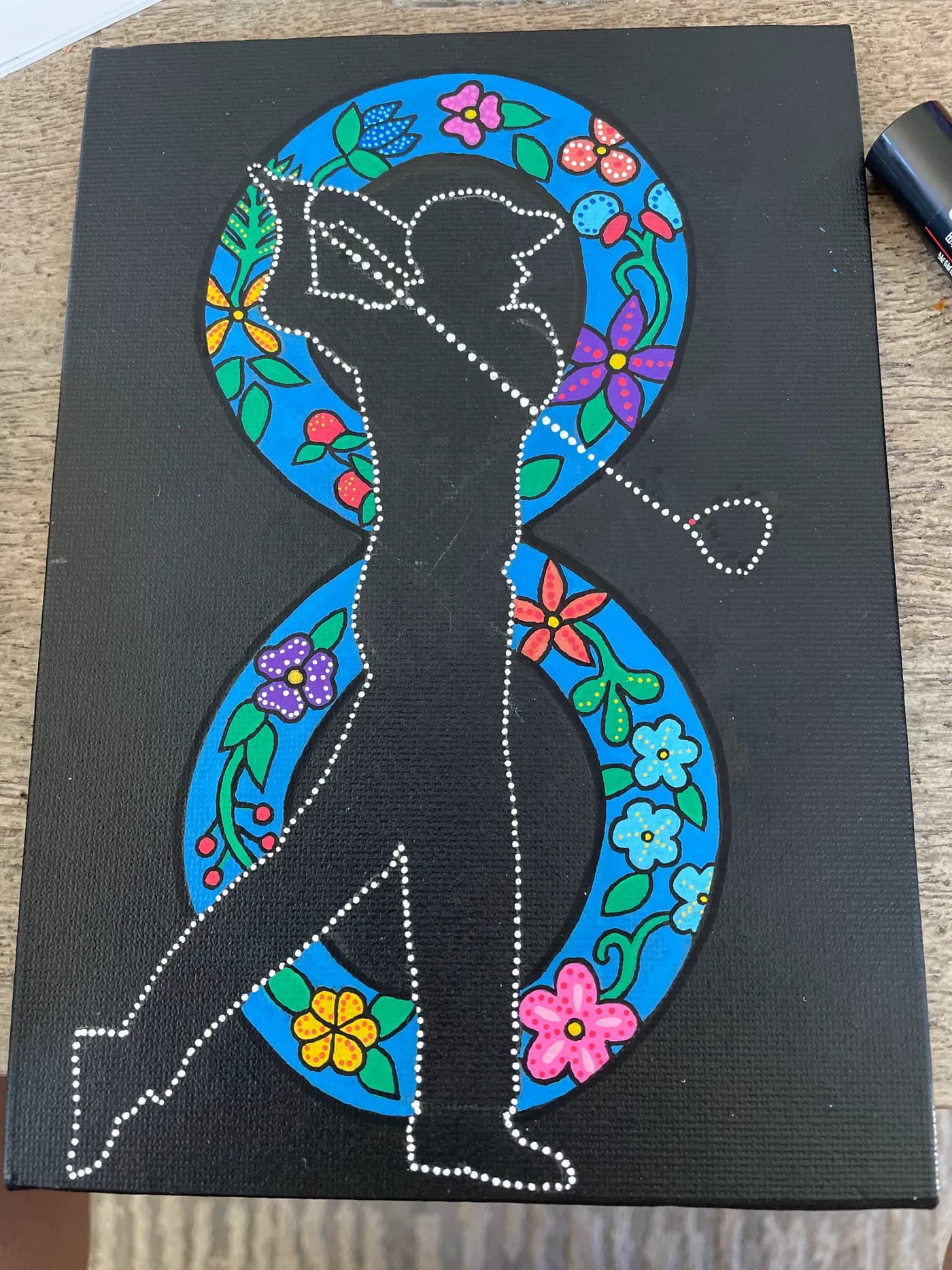 Dot painting of a golfer inside an infinity symbol with flowers